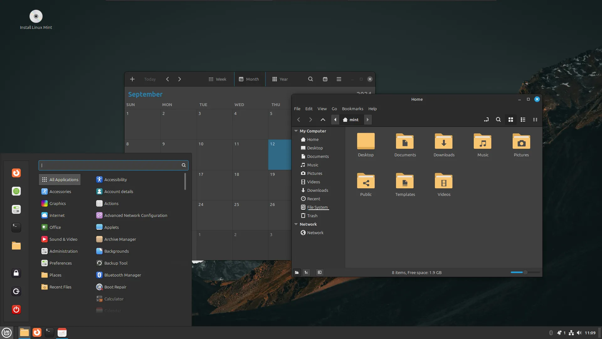 Giao diện desktop Linux Mint với ứng dụng lịch và trình duyệt tệp mở