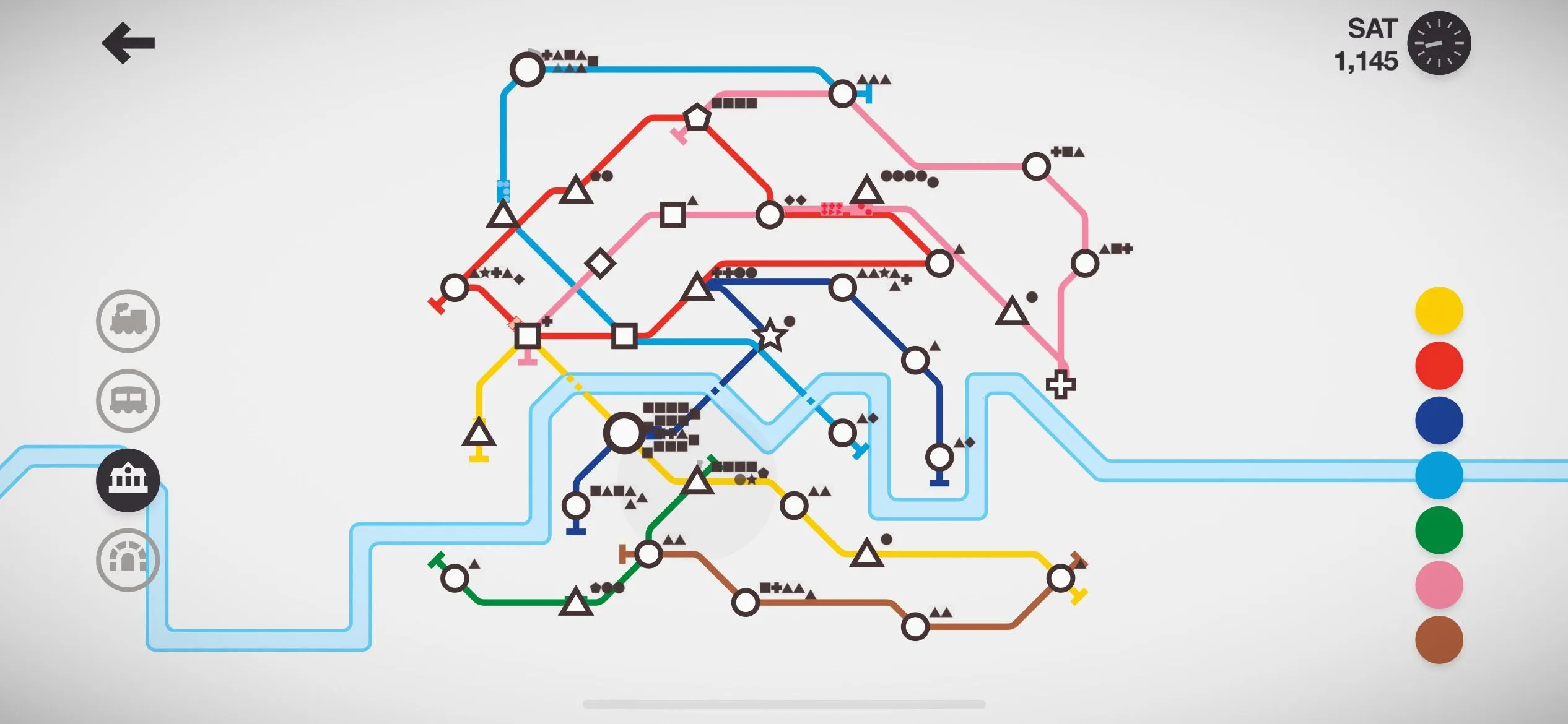 Giao diện game Mini Metro trên iPhone, hiển thị bản đồ đường sắt đơn giản với các tuyến đường và nhà ga màu sắc