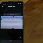 Hình ảnh điện thoại sử dụng Google Lens để trích xuất văn bản từ một tài liệu giấy, minh họa tính năng sao chép thông tin nhanh chóng.