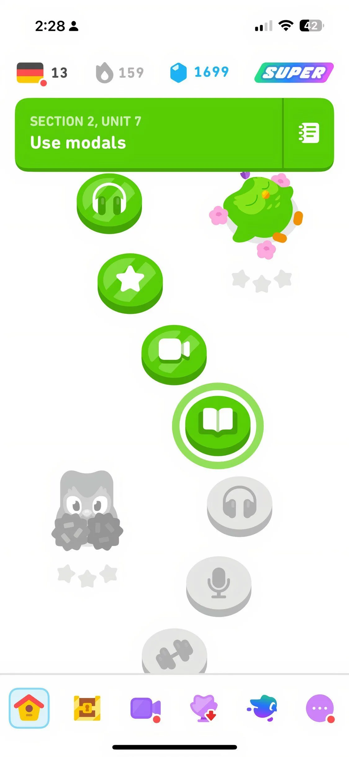 Hình ảnh màn hình Duolingo với bài học ngôn ngữ theo dạng trò chơi tương tác.