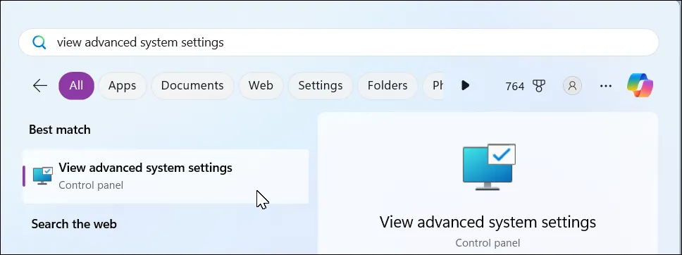 Thanh tìm kiếm Windows 11 mở với từ khóa "view advanced system settings"